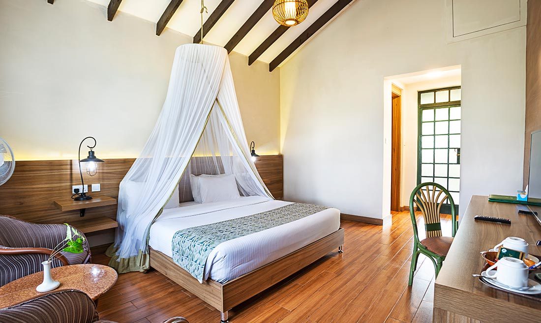 A luxurious executive suite with a separate lounge area